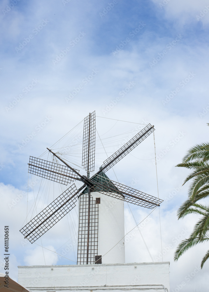Es Mercadal white windmill on a hill on a cloudless summer day
