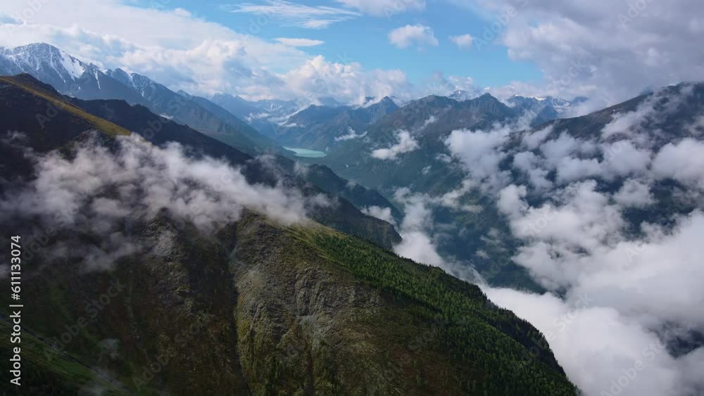 Mesmerizing alpine view: green mountains and cloud-filled valley Mesmerizing alpine view: green mountains and cloud-filled valley