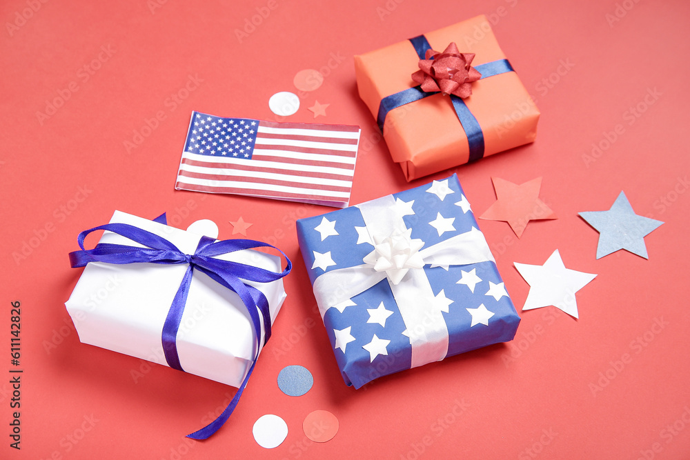 Gift boxes with USA flag and confetti on red background. American Independence Day Gift boxes with USA flag and confetti on red background. American Independence Day