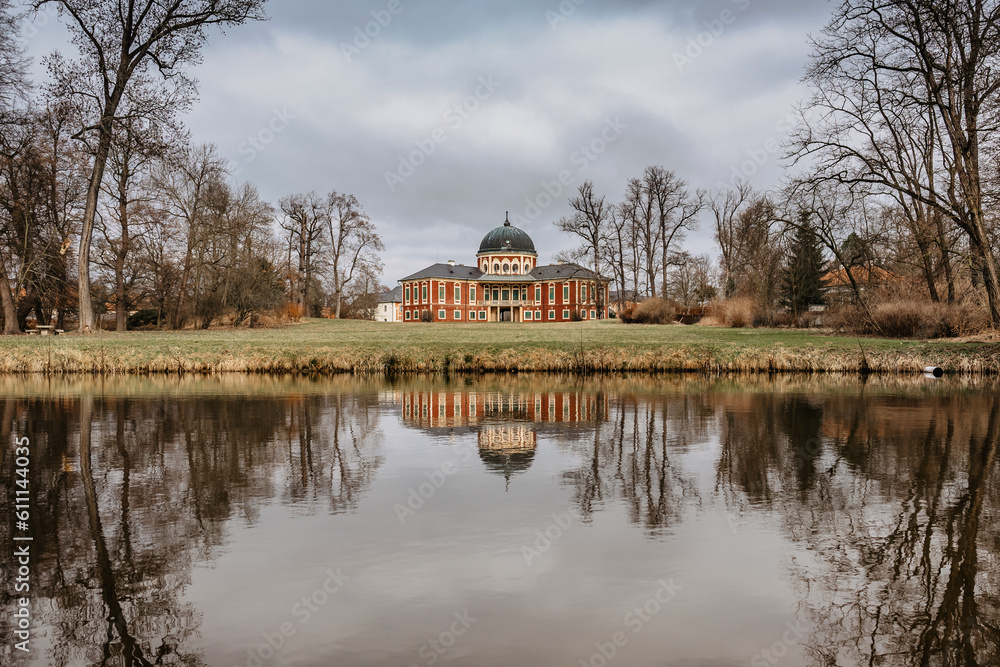 Veltrusy Castle,baroque chateau with large park,popular tourist landmark,Czech Republic.Beautiful residence in Czech countryside with representative rooms,courtyard and conical roof.Water reflection Veltrusy Castle,baroque chateau with large park,popular tourist landmark,Czech Republic.Beautiful residence in Czech countryside with representative rooms,courtyard and conical roof.Water reflection