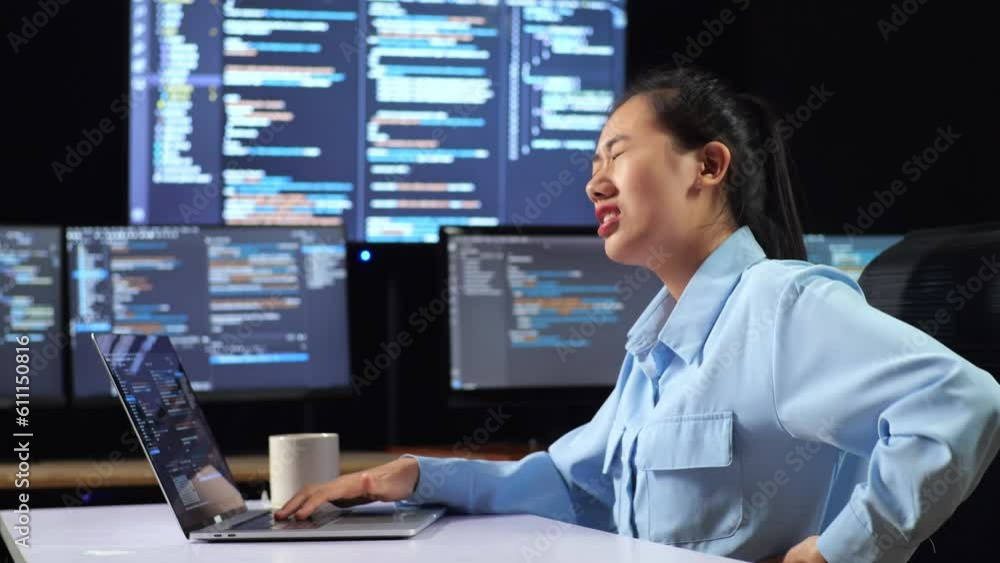 Side View Of Asian Female Programmer Having A Backache While Writing Code By A Laptop Using Multiple Monitors Showing Database On Terminal Window Desktops In The Office
Side View Of Asian Female Programmer Having A Backache While Writing Code By A Laptop Using Multiple Monitors Showing Database On Terminal Window Desktops In The Office