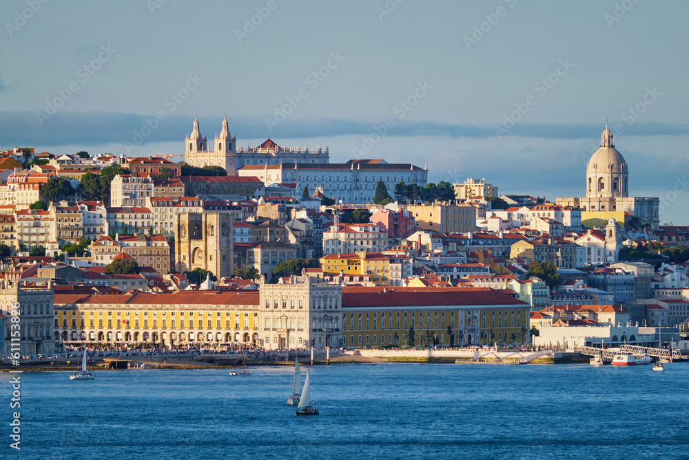 View of Lisbon over Tagus river from Almada with yachts tourist boats on sunset. Lisbon, Portugal