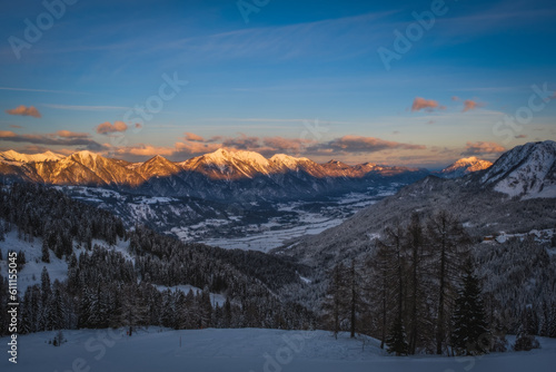 Alpenglow at sunset time on mountain peak at Nassfeld ski resort, Carinthia, Austria. January 2022