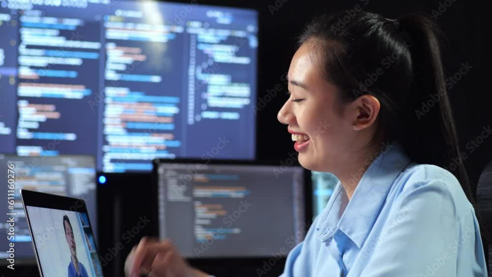 Close Up Side View Of Asian Female Programmer Having A Meeting By A Laptop While Writing Code On Multiple Monitors Showing Database On Terminal Window Desktops In The Office
Close Up Side View Of Asian Female Programmer Having A Meeting By A Laptop While Writing Code On Multiple Monitors Showing Database On Terminal Window Desktops In The Office