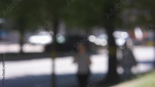 Wallpaper Mural blurred defocused bokeh city street driving cars people go summer day motions view through window on town lifestyle. daytime working day in city concept. blurry downtown road street Torontodigital.ca