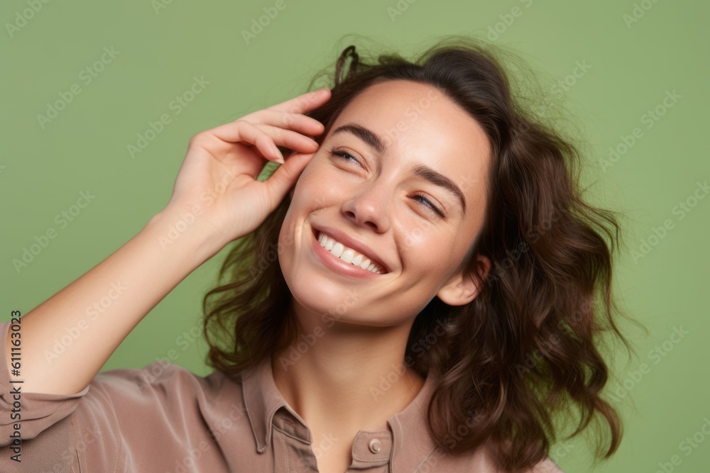 Headshot portrait photography of a grinning girl in her 30s putting the hand on the forehead to look for someone in the distance against a pastel green background. With generative AI technology Headshot portrait photography of a grinning girl in her 30s putting the hand on the forehead to look for someone in the distance against a pastel green background. With generative AI technology