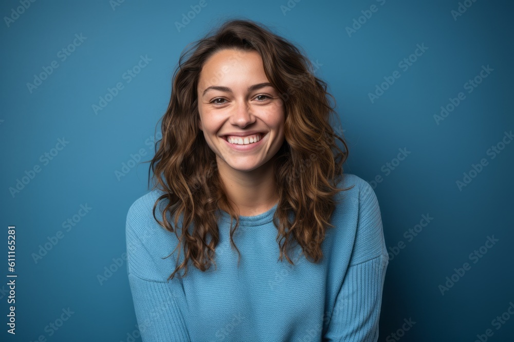 Medium shot portrait photography of a grinning girl in her 30s crossing the arms against a cerulean blue background. With generative AI technology Medium shot portrait photography of a grinning girl in her 30s crossing the arms against a cerulean blue background. With generative AI technology