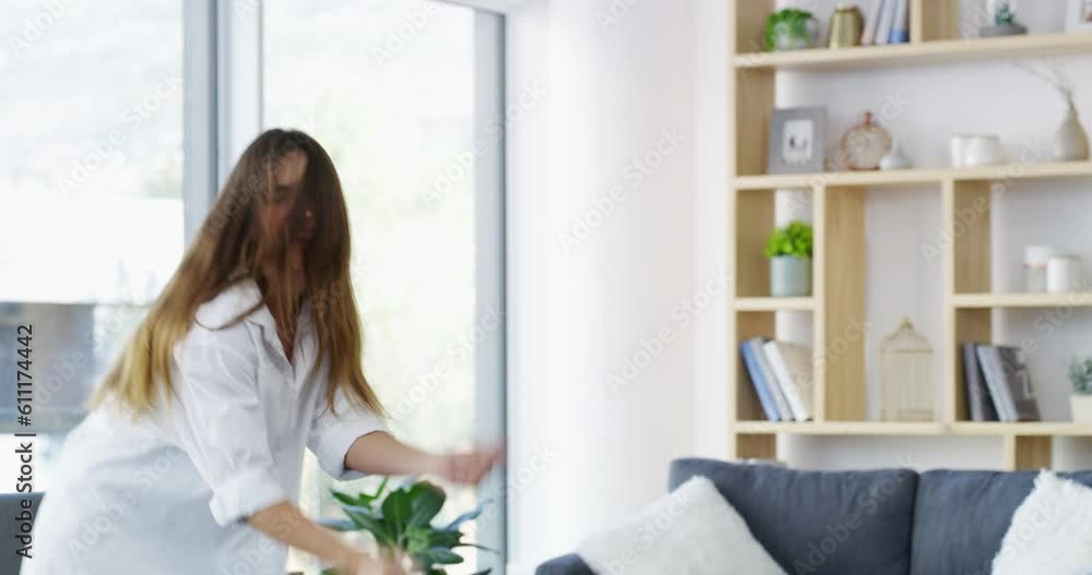 Dance, energy and woman in the living room with music, song or radio in modern apartment. Happy, freedom and female person dancing, having fun and streaming album in lounge in the morning at home. Dance, energy and woman in the living room with music, song or radio in modern apartment. Happy, freedom and female person dancing, having fun and streaming album in lounge in the morning at home.