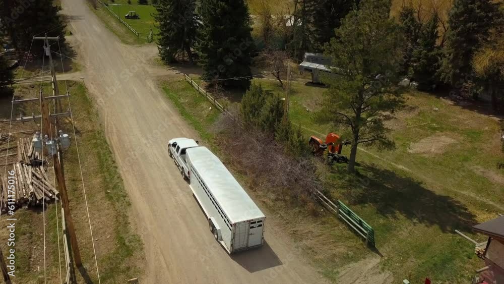 Aerial Shot Of Livestock Trailer Moving On Road At Countryside During Sunny Day - Billings, Montana Aerial Shot Of Livestock Trailer Moving On Road At Countryside During Sunny Day - Billings, Montana