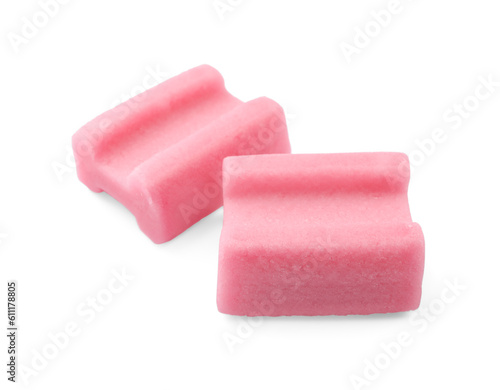 Tasty pink chewing gums on white background