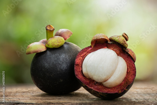 Mangosteen or Garcinia mangostana fruit on nature background. photo