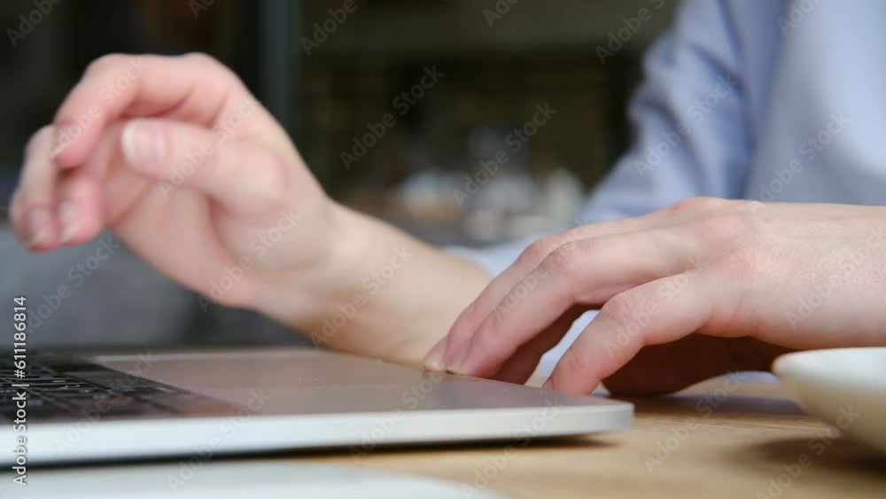 Close up of female hands typing on modern laptop keyboard making notes writing on device Close up of female hands typing on modern laptop keyboard making notes writing on device