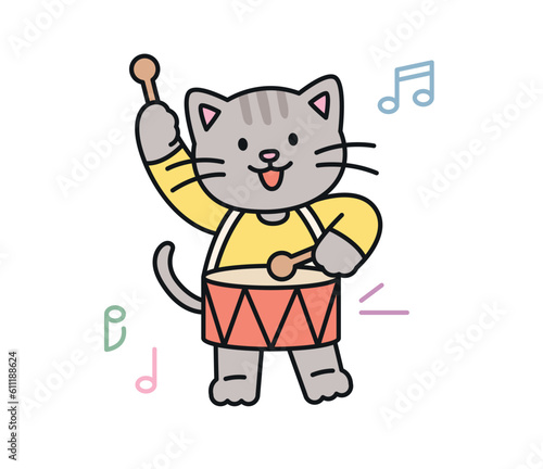 Cute cat. A gray cat is happily playing the snare drum.