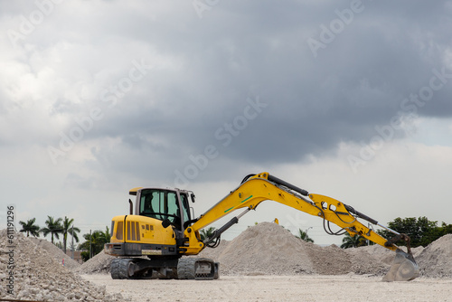 Photography of a excavetor at a land fill.