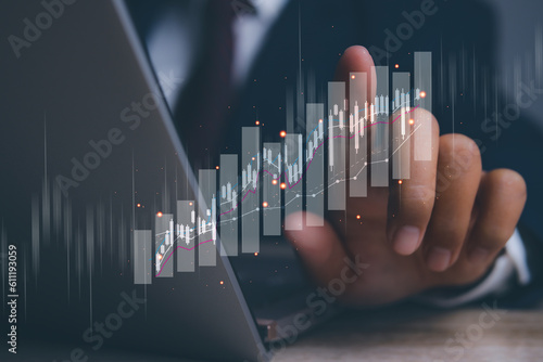 Businessman using laptop with forex trading graph financial data. Goal business success strategy chart target and planning. Stock market, financial graph growth report, business development.