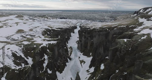 Drone Shot of Fjadrargljufur Canyon, Natural Landmark of Iceland on Cold WInter Day photo