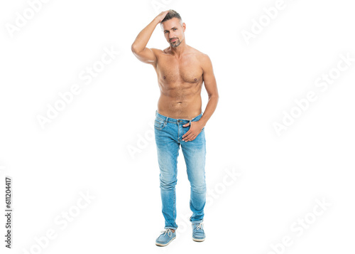 muscular man shows abs and torso in studio. A man with physique poses shirtless showing muscular torso. muscular man stands with torso isolated on white. shirtless man with muscular torso