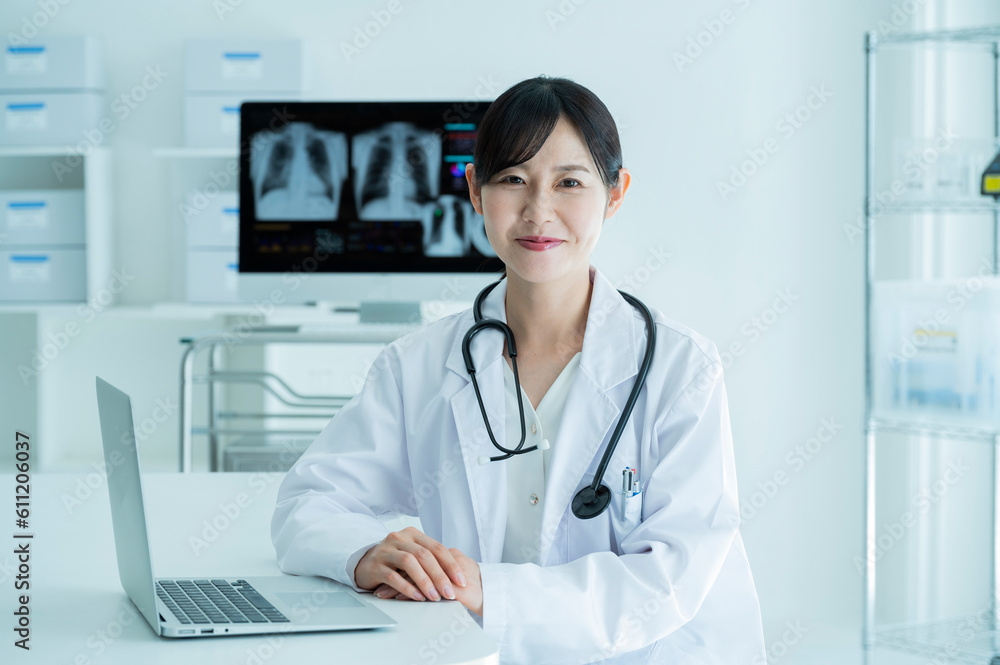 Portrait of a female doctor wearing a white coat Portrait of a female doctor wearing a white coat