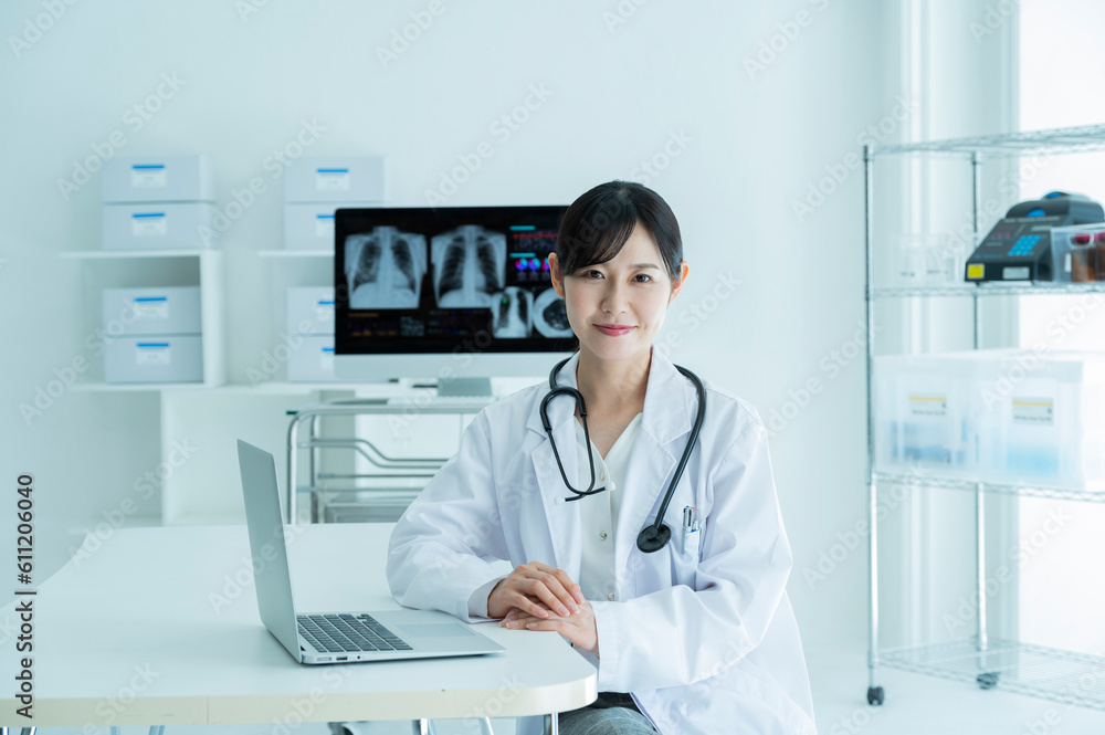 Portrait of a female doctor wearing a white coat Portrait of a female doctor wearing a white coat