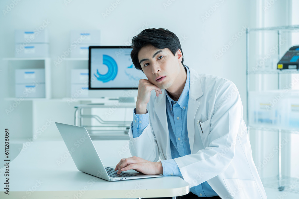Portrait of a male doctor wearing a white coat Portrait of a male doctor wearing a white coat