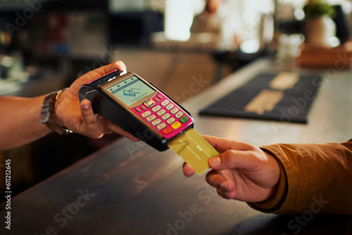 Debit card, point of sale and hands of coffee shop people, cashier or barista with easy fintech payment of hospitality service. Cafe customer, B2C and store person, server or waiter with POS machine photo