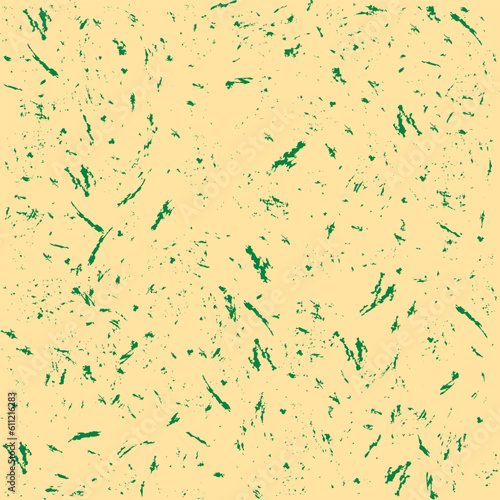 Seamless print pattern of green splashes on a yellowish background