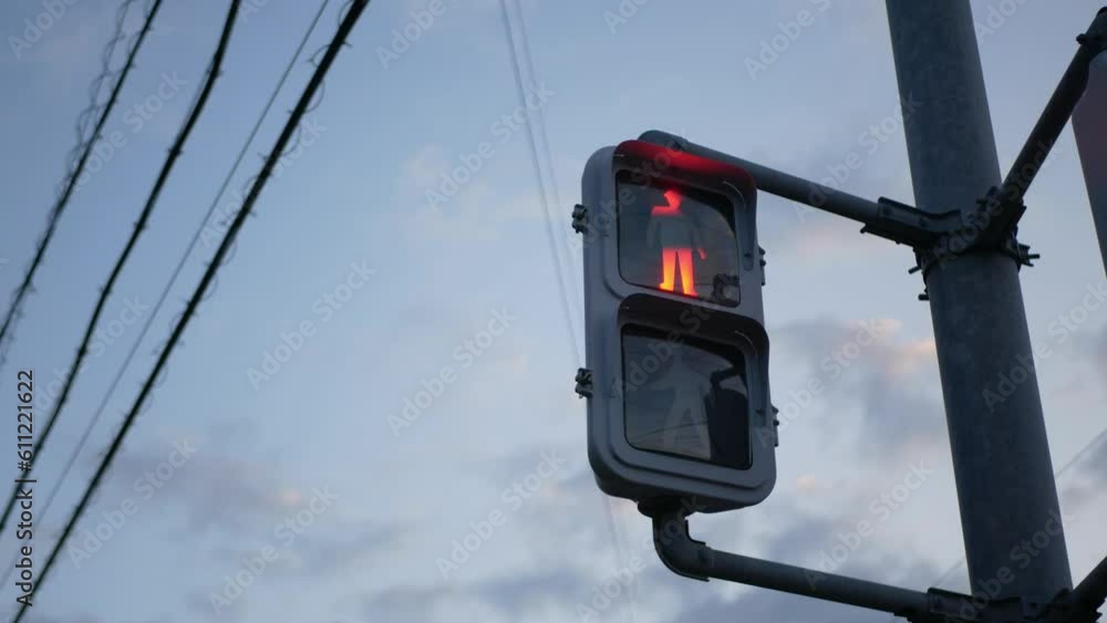 look up view to the cross road signal light sign with background of the clear blue sky in sunset time look up view to the cross road signal light sign with background of the clear blue sky in sunset time