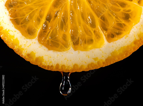 An orange, sliced and dripp...