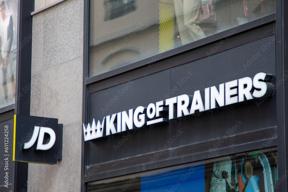 jd king of trainers logo brand and text on sporty shop facade wall sign