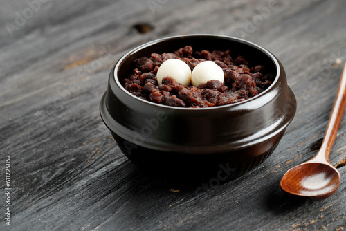 Patjuk, Korean Red Bean Porridge with Rice Cake on Top. photo