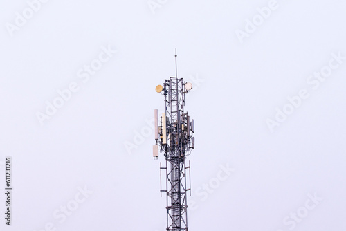 Telecommunication tower. Wireless Communication Antenna Transmitter with antennas bright sunlight and sky background. tower 4G, 5G cellular Base Station or Base Transceiver Station future technology.