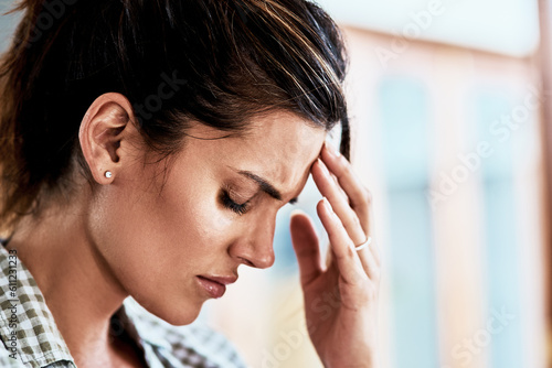 Woman, pain and hand on head for headache, stress and suffering brain fog or temple massage for anxiety, fatigue or depression. Person, migraine or mental health problem and frustrated with burnout