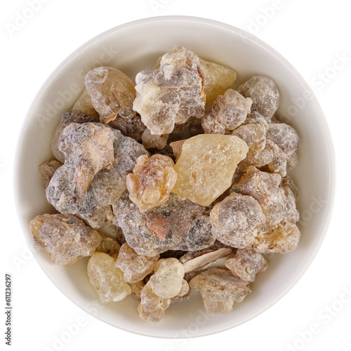 Overhead view of frankincense from Oman (Boswellia sacra), a tree resin, in a white bowl, isolated on background