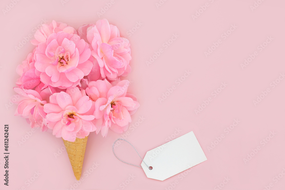 Surreal rose flower abstract ice cream waffle cone with gift tag. Minimal design on pastel pink background. Summer creative fun concept for birthday anniversary Valentines Wedding or Mothers Day. Surreal rose flower abstract ice cream waffle cone with gift tag. Minimal design on pastel pink background. Summer creative fun concept for birthday anniversary Valentines Wedding or Mothers Day.