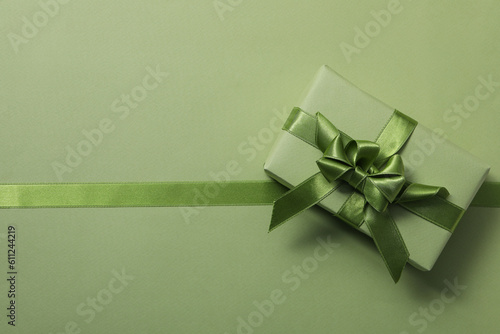 Concept of different ribbons, gift box on green background