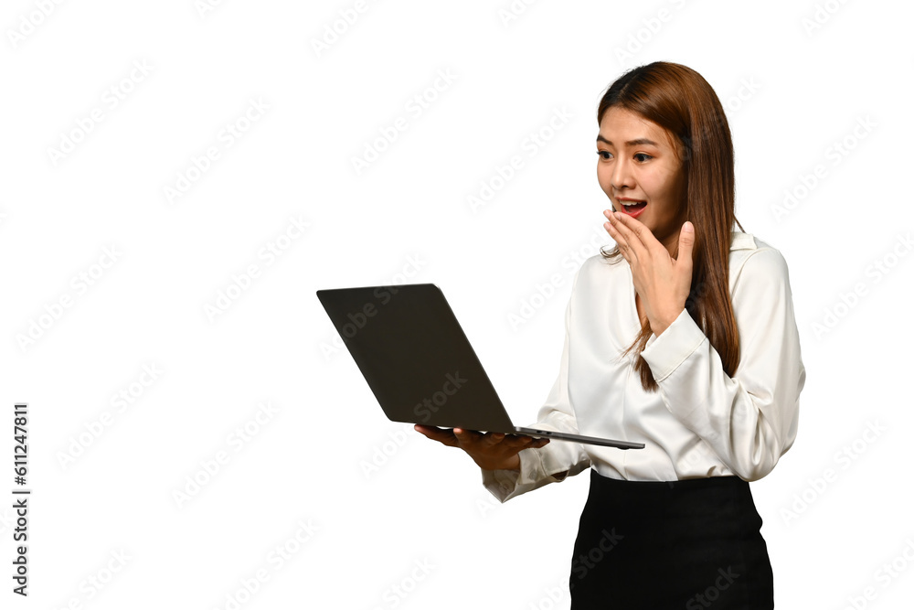 Surprised young businesswoman looking at laptop screen, feeling amazed isolated over white background Surprised young businesswoman looking at laptop screen, feeling amazed isolated over white background