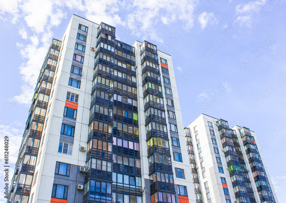 Fototapeta premium Architectural design of apartment buildings. External view of a new building, residential building, apartments. Modern houses, apartments.Facade of a high-rise apartment