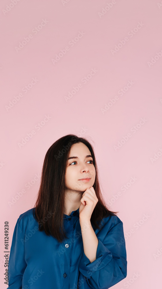 Serenity and Contemplation: Mindful Portrait of a Beautiful Girl with Hand on Chin, Gazing into Empty Space, Isolated on a Calming Pink Background. Serenity and Contemplation: Mindful Portrait of a Beautiful Girl with Hand on Chin, Gazing into Empty Space, Isolated on a Calming Pink Background.