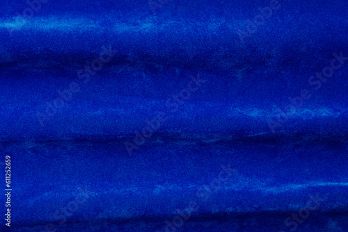 blue velvet fabric texture used as background. blue fabric background of soft and smooth textile material. There is space for text..