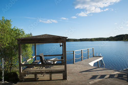 Beautiful wooden balcony on a lake in Sweden. Peace and relax in a natural park. Holiday destination