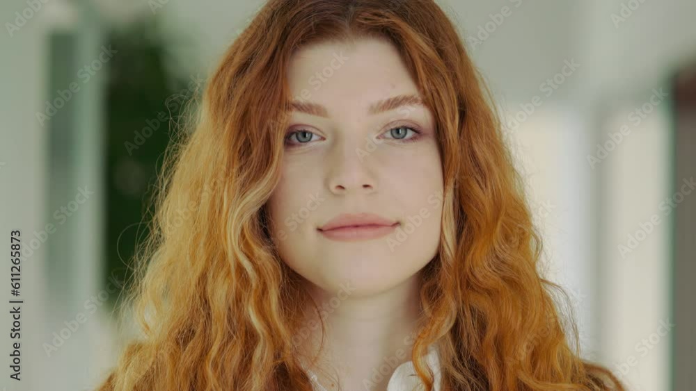 Attractive Redhead Office Worker with Blue Eyes Posing Inside. Businesswoman. Attractive Redhead Office Worker with Blue Eyes Posing Inside. Businesswoman.