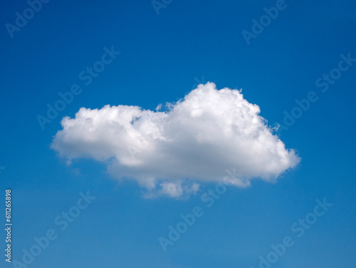 Fototapeta Naklejka Na Ścianę i Meble -  Single white cloud over blue sky background. Fluffy cloud shape photo