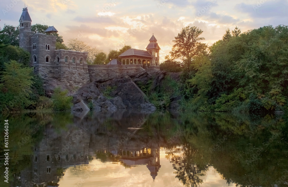  summer castle and water with sunset in central park backlit 
