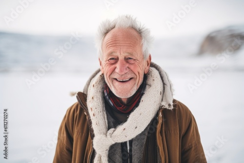 Environmental portrait photography of a joyful old man wearing a cozy sweater against a snowy landscape background. With generative AI technology