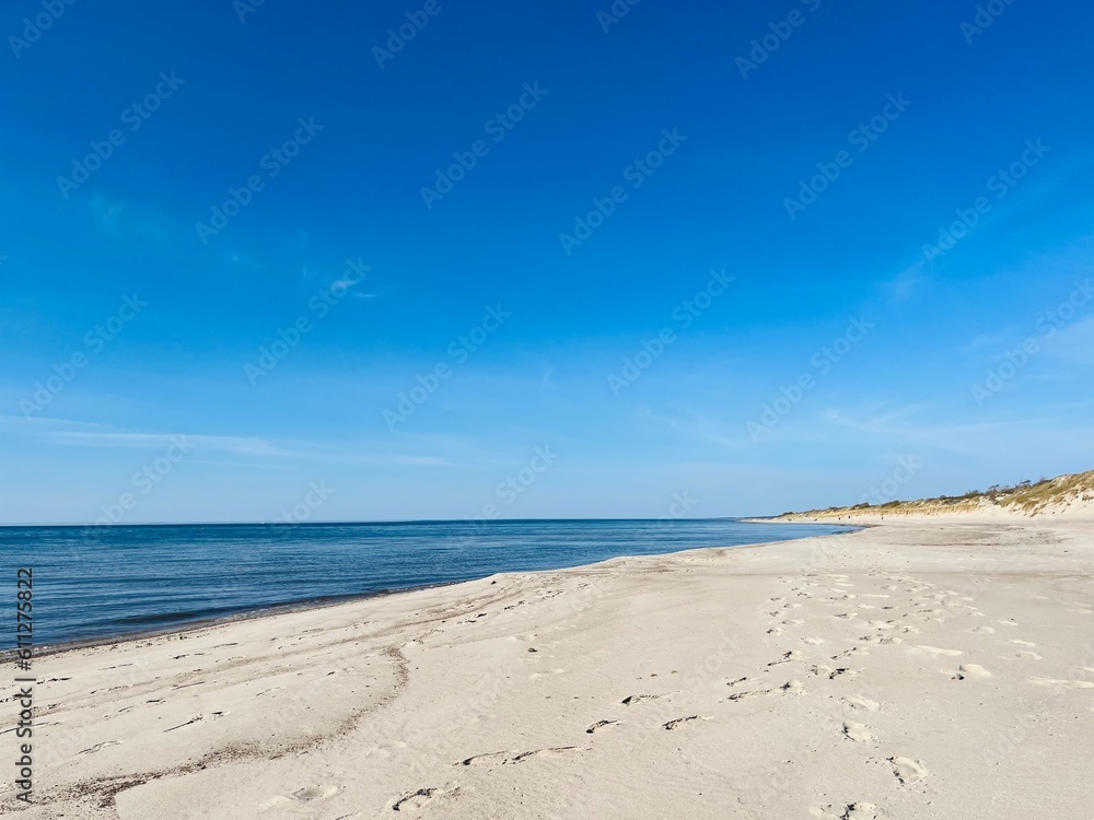 Blue sea horizon and white sandy coastline, wild empty sandy beach, blue sea horizon Blue sea horizon and white sandy coastline, wild empty sandy beach, blue sea horizon