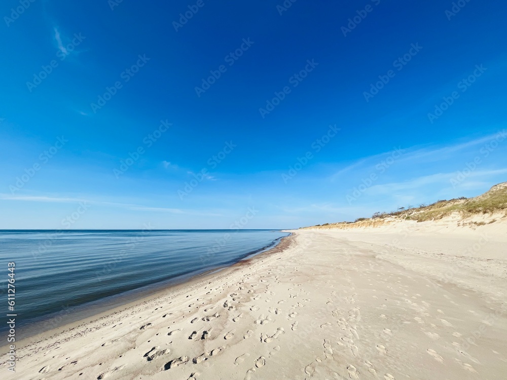 Blue sea horizon and white sandy coastline, wild empty sandy beach, blue sea horizon Blue sea horizon and white sandy coastline, wild empty sandy beach, blue sea horizon