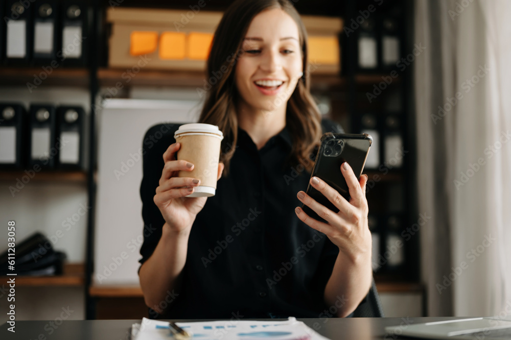 businesswoman hand using smart phone, tablet payments and holding credit card online shopping, omni channel, digital tablet docking keyboard computer at office businesswoman hand using smart phone, tablet payments and holding credit card online shopping, omni channel, digital tablet docking keyboard computer at office