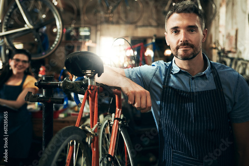 Serious, portrait and technician man in bicycle shop working in store or cycling workshop for repair. Face, bike mechanic and confident male person, business owner or mature professional with pride © Grady Reese/peopleimages.com