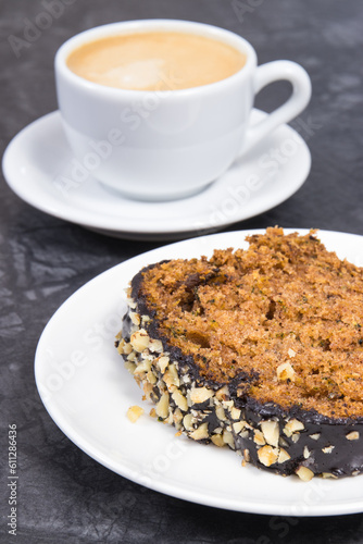 Fresh baked pastry made of zucchini and cup of white coffee. Delicious dessert