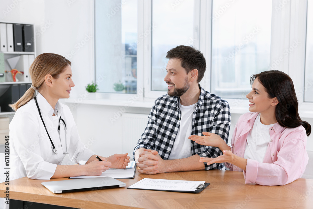 Couple having appointment with fertility doctor in clinic. Patient consultation Couple having appointment with fertility doctor in clinic. Patient consultation
